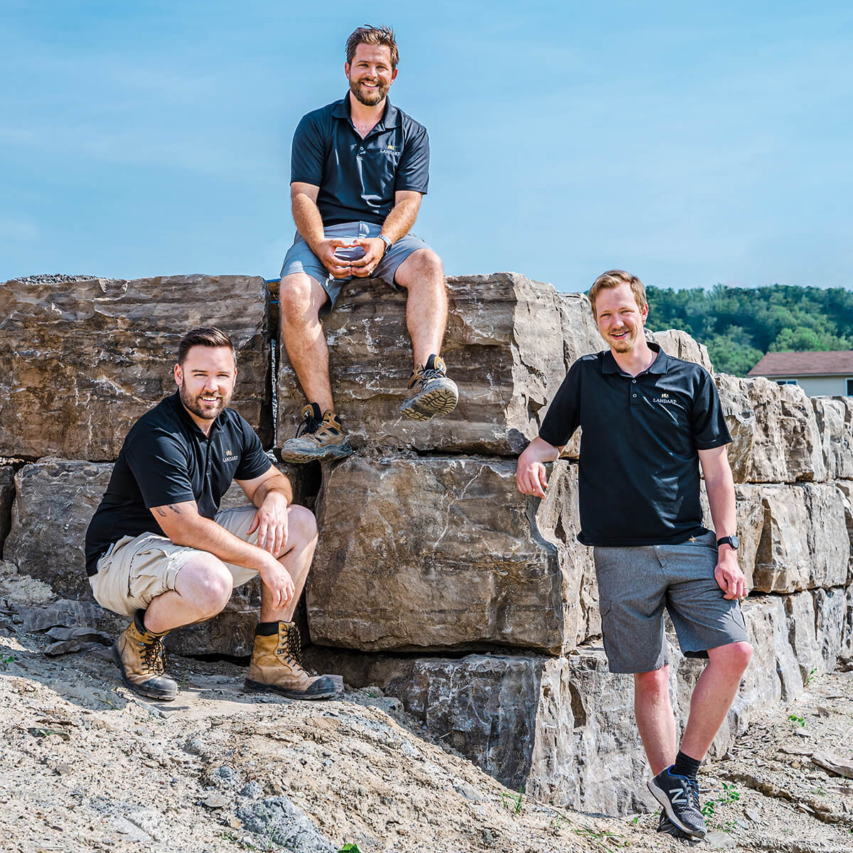 LandArt co-owner Richard Wynia (middle) with team members Matte Crossman and Devon Kleinjan.